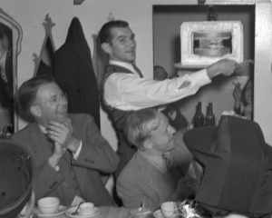 DiBiasi Restaurant dinner. Ernest Orlando Lawrence (left), Harold Walke, and Paul Aebersold (with cake), taken November 17, 1939. Radiation Lab dinner in honor of Ernest Orlando Lawrence for winning the Nobel Prize.